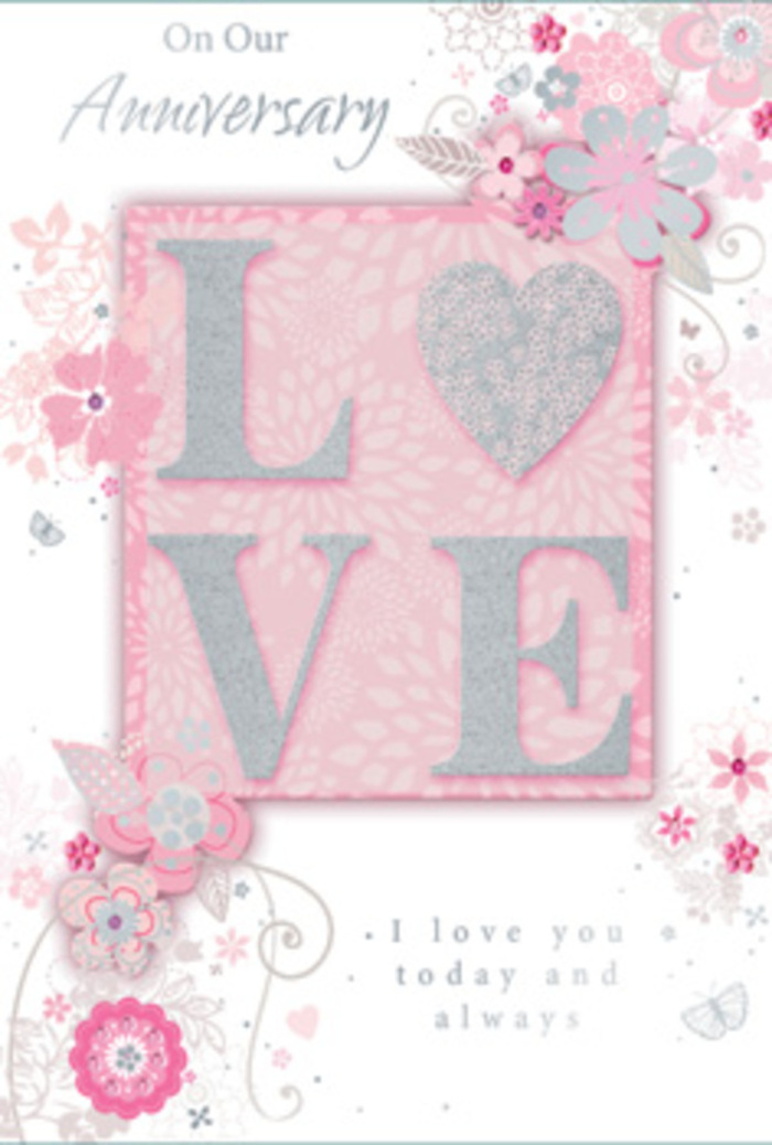 The anniversary card in this image feels like a keepsake you might tuck beside a vase of fresh blooms on a windowsill overlooking Hitchin's cobbled streets. The main focus is the word LOVE, prominently placed in the middle of the design, each letter raised from the surface and edged with delicate, glittering accents. The effect is both visual and tactile: you can almost sense how the slightly rough glitter contrasts with the smooth cardstock beneath, inviting a slow, affectionate touch. The colour palette is soft and dreamy, centred around blush pinks, creamy whites, and refined silvers that recall a hand-tied bouquet of pastel roses and gypsophila. A wash of soft pink forms the backdrop, providing a gentle warmth against which the letters and illustrations stand out. Flowing around the word LOVE are stylised flowers, leaves, and sinuous stems, sketched with fine lines as if a florist had traced the first idea for an anniversary arrangement. The blooms cluster in loose sprays at the corners and edges, then trail inward in swirling arcs that frame the text. Subtle gradations of pink, ivory, and light grey add depth to each petal, while hints of silver pick out the contours of leaves and delicate flourishes. The overall composition feels as balanced as a well-composed bouquet, neither too busy nor too bare, with pockets of open space that let the eye rest. Inside, graceful script shares heartfelt anniversary sentiments, reinforcing the sense of trust, loyalty, and everyday tenderness. The card captures the quiet joy of celebrating another year side by side, perhaps after collecting fresh flowers from a favourite Hitchin florist on the way home.